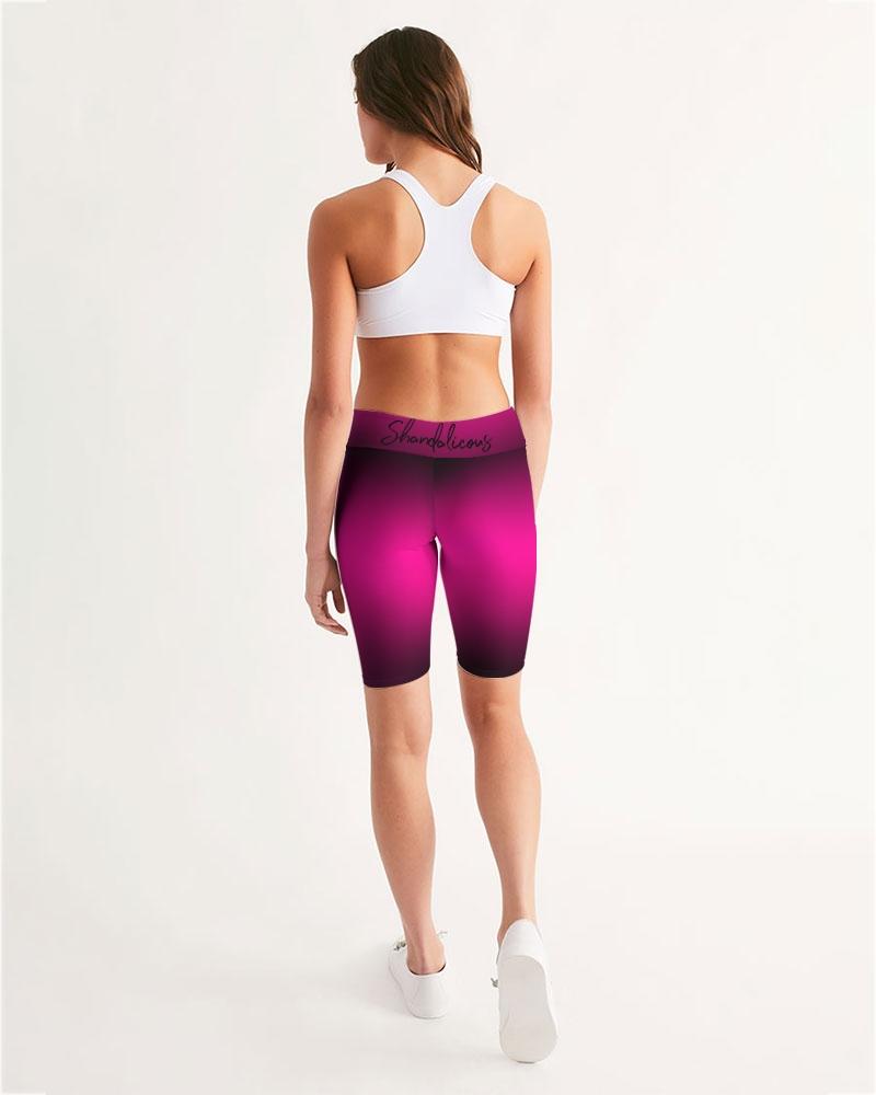 Mystic Women's Mid-Rise Bike Shorts featuring a black to dark pink gradient design, showcasing a comfortable waistband and breathable fabric.