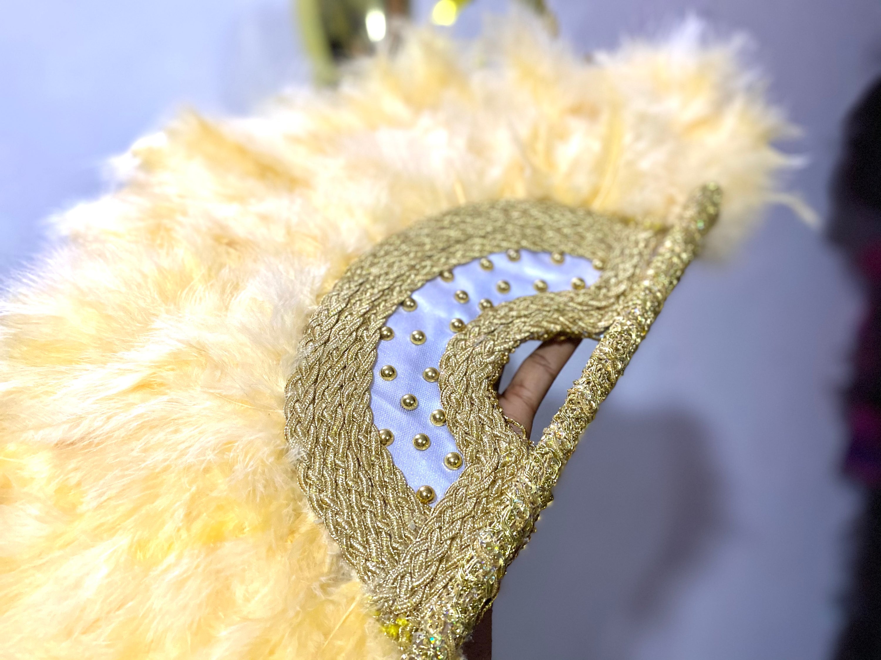 Nadia Dance Fan featuring fluffy feathers, customizable colors, and elegant tassels, perfect for dance performances.