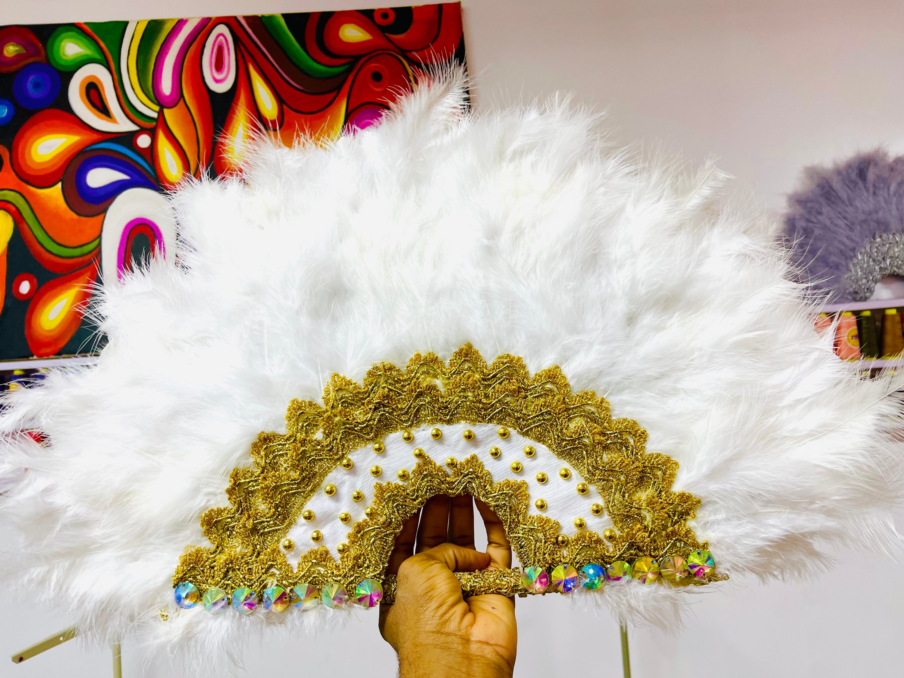 Nadia Dance Fan featuring fluffy feathers, customizable colors, and elegant tassels, perfect for dance performances.