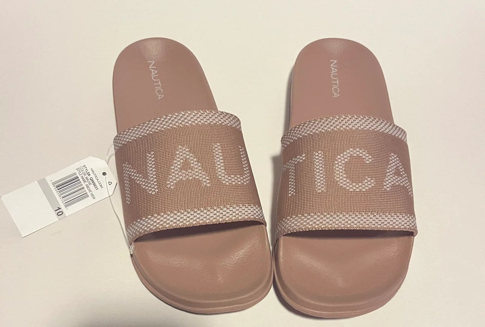 A pair of Nautica Sandals featuring a padded footbed and stylish slip-on design, perfect for casual wear.