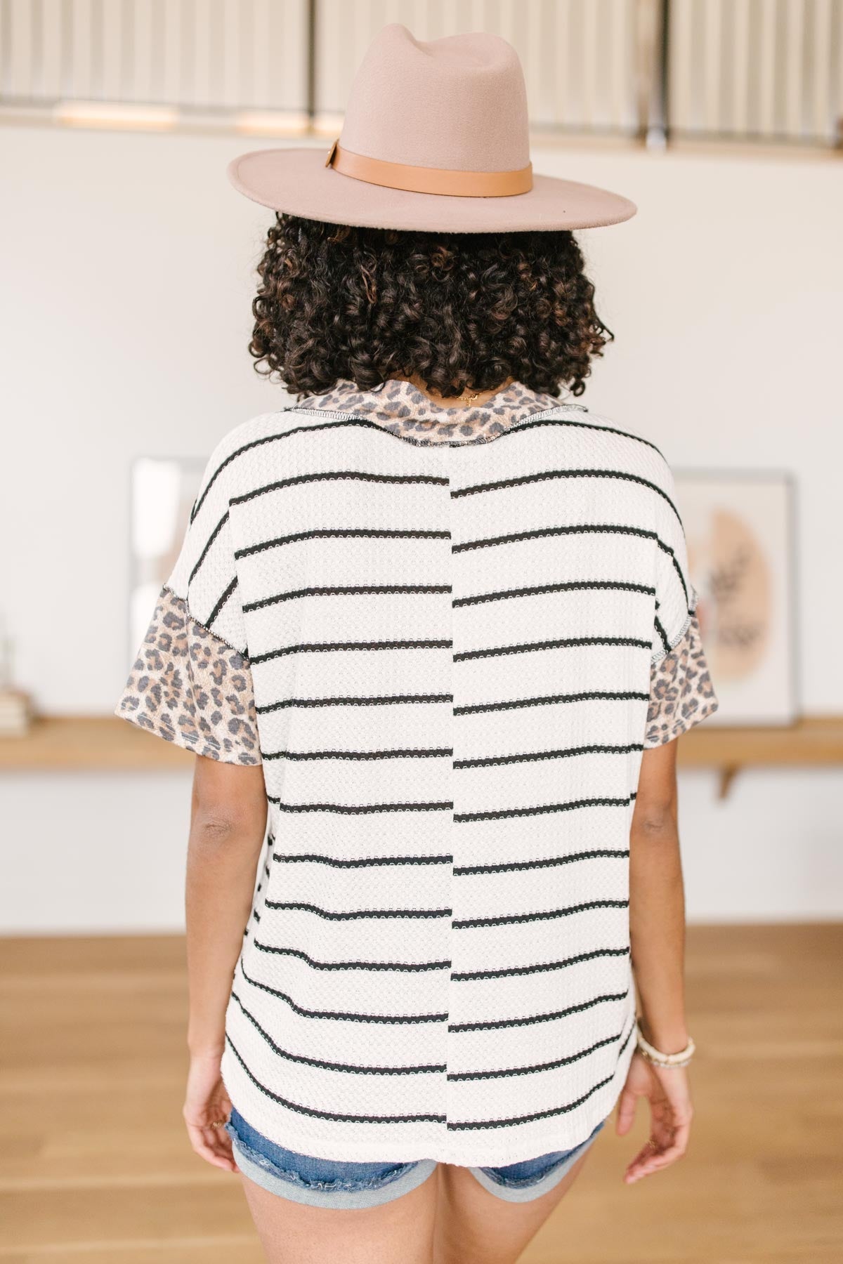 Nautical Jane Top featuring a blend of animal print and stripes, made from lightweight and stretchy waffle knit material.