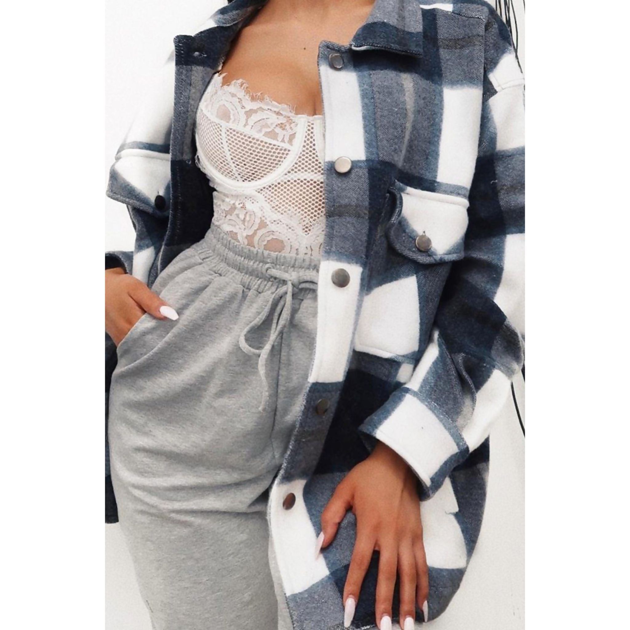 Navy blue checked shacket for women featuring beige check print, oversized fit, and button fastening.