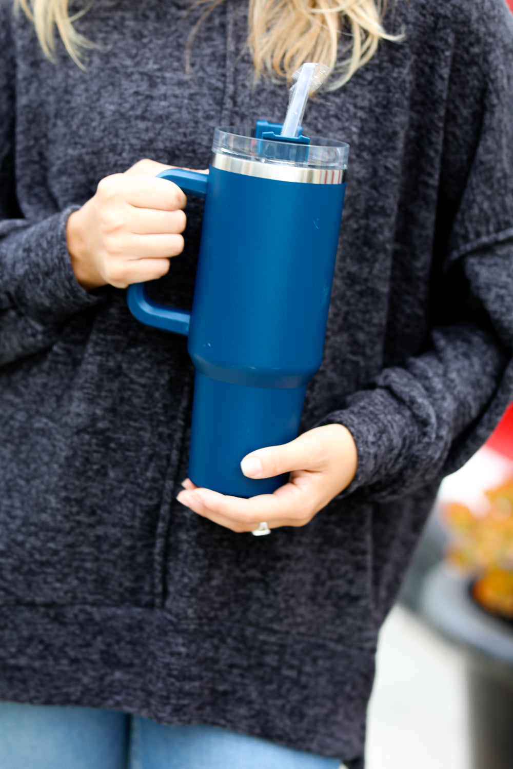 Navy Insulated 38oz. Tumbler with Straw, featuring a handle and spill-proof lid.