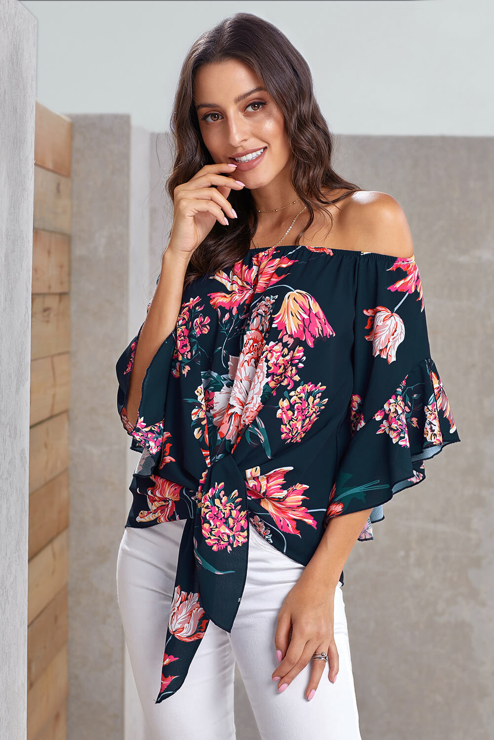 Navy off shoulder floral tie front high low chiffon blouse with 3/4 sleeves, showcasing a stylish and elegant design.