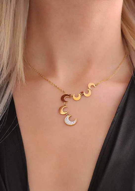 Elegant gold necklace featuring moon-shaped pendants, showcasing a stylish design perfect for any outfit.