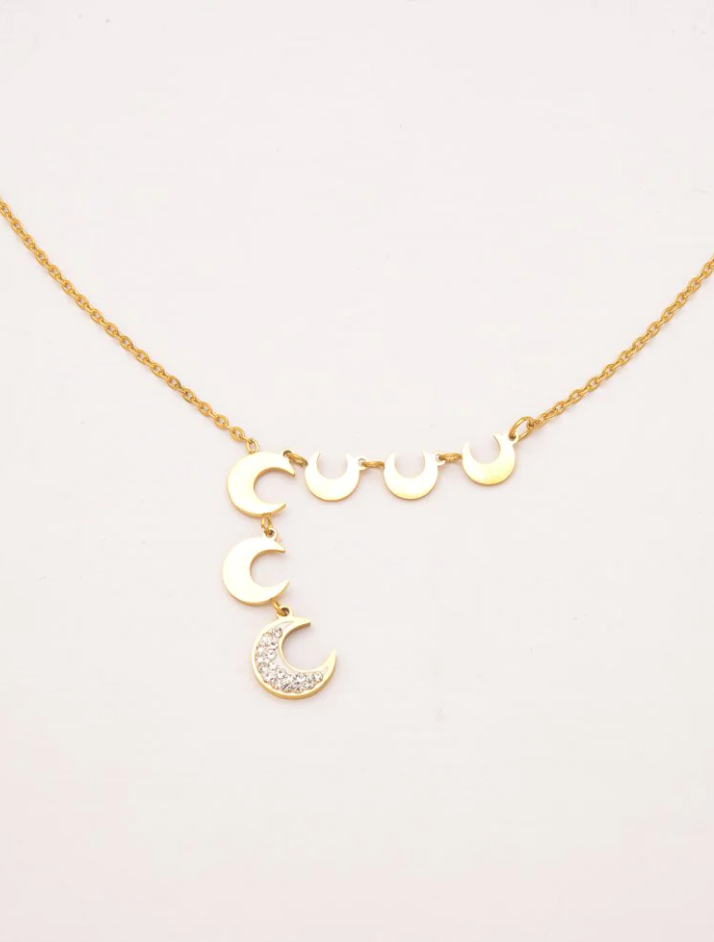 Elegant gold necklace featuring moon-shaped pendants, showcasing its unique design and craftsmanship.