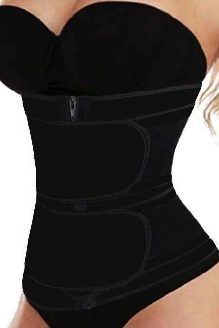 Woman wearing a black waist trainer.