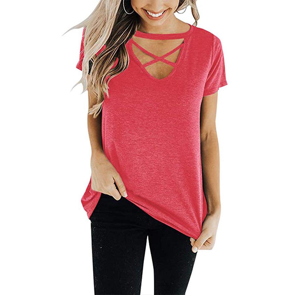 A stylish women's top featuring a front chest cross design, V-neckline, and short sleeves, made from soft cotton material in a solid color.