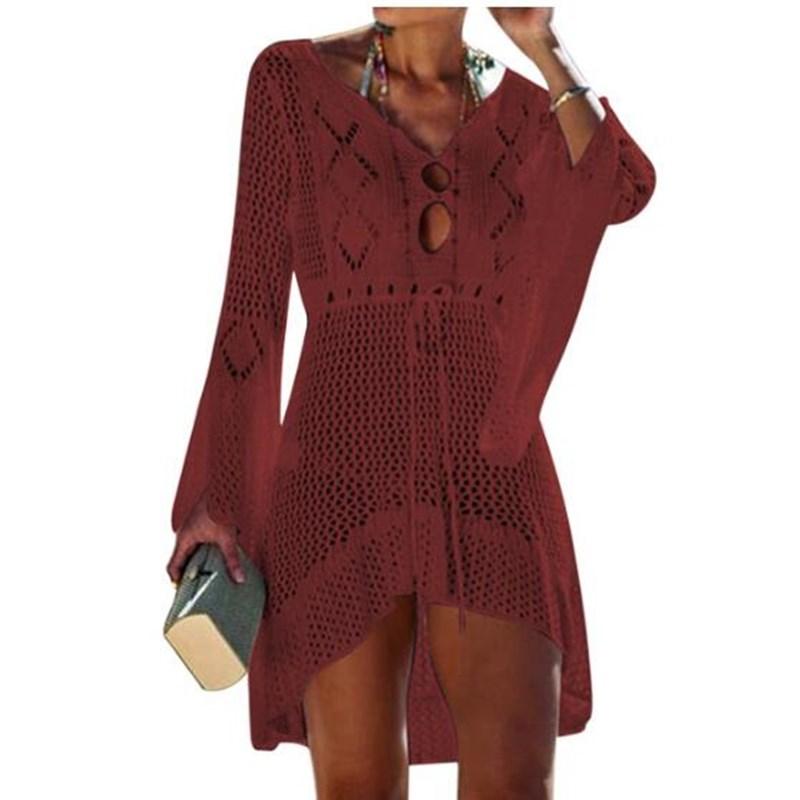 A stylish crochet beach cover-up for women featuring knitted tassels, available in multiple colors including orange, black, white, green, blue, and wine.