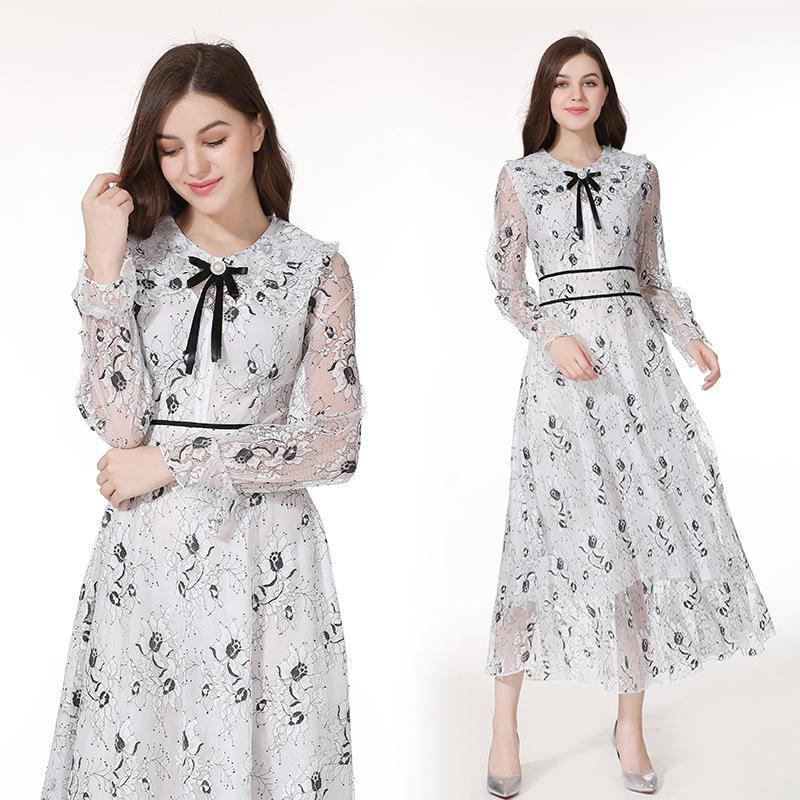 A stylish long sleeve dress featuring a beautiful flower bud print, perfect for elegant occasions.