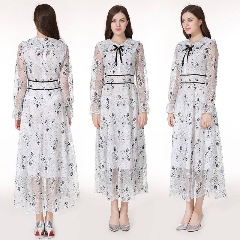 A stylish long sleeve dress featuring a beautiful flower bud print, perfect for elegant occasions.