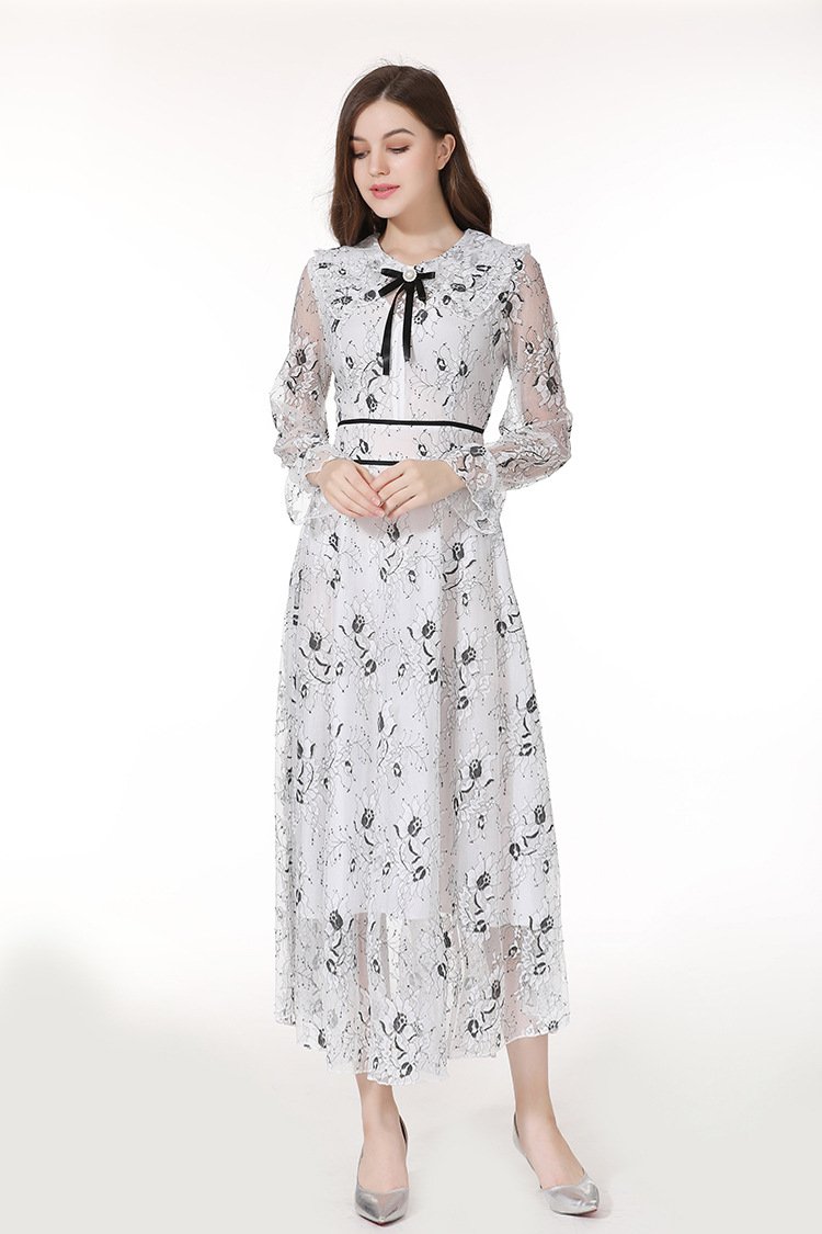 A stylish long sleeve dress featuring a beautiful flower bud print, perfect for elegant occasions.