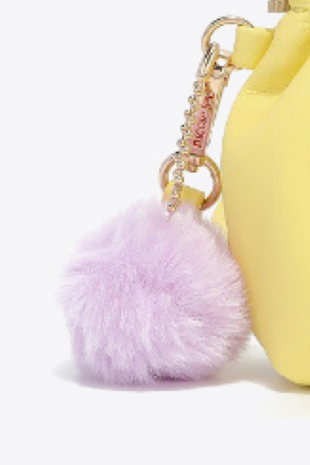 Nicole Lee USA Faux Leather Pouch in two-tone design with gold-tone hardware and detachable pompom keychain.