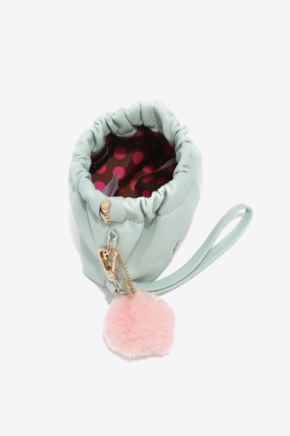 Nicole Lee USA Faux Leather Pouch in two-tone design with gold-tone hardware and detachable pompom keychain.