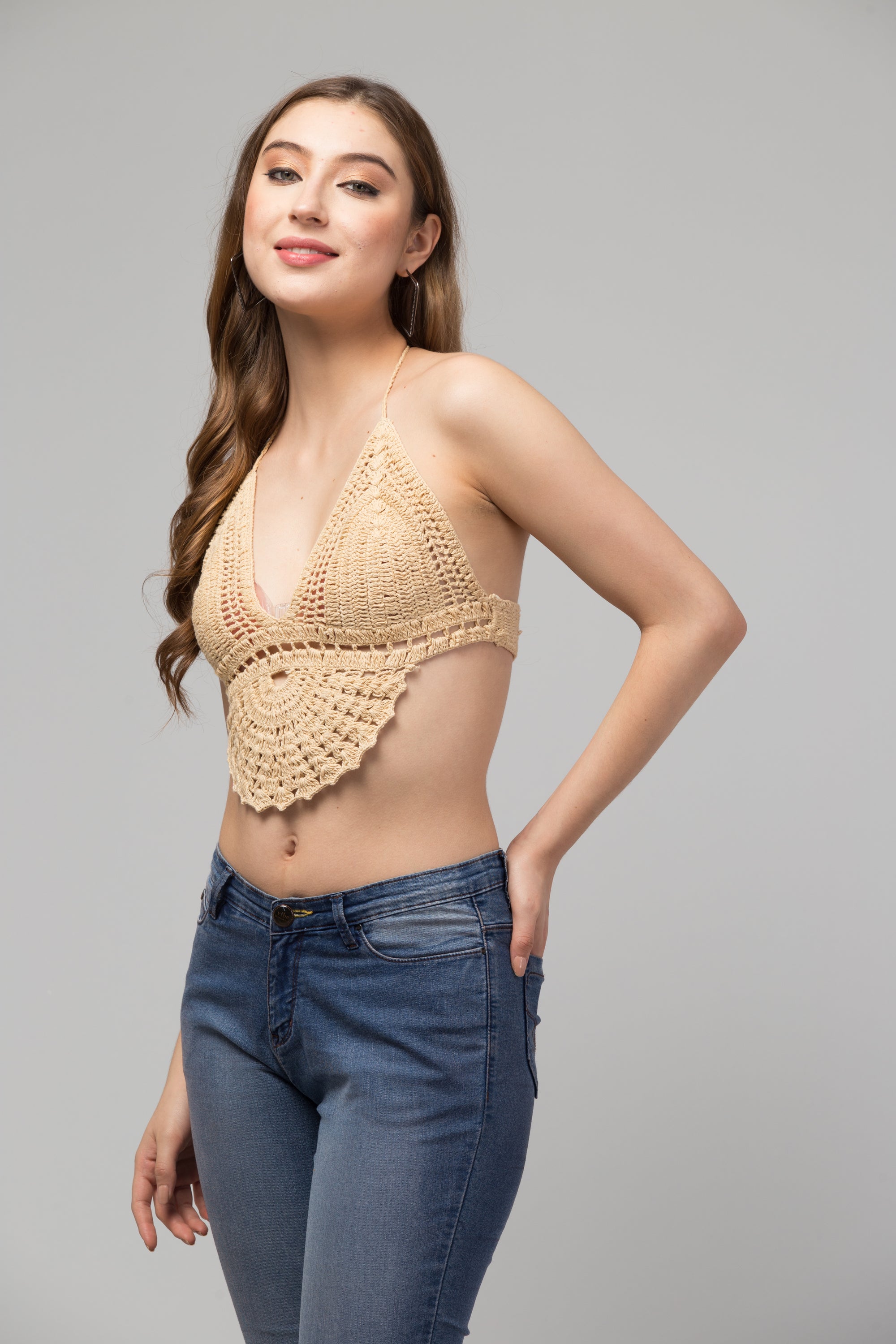 Nina Crop Top-Bralette made from organic green fabric, showcasing intricate hand-crocheted design.