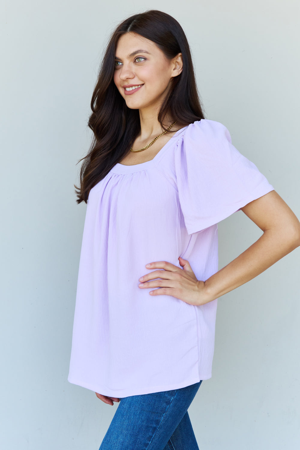 Ninexis Keep Me Close Square Neck Short Sleeve Blouse in Lavender, featuring ruffle neck detailing and short puff sleeves.