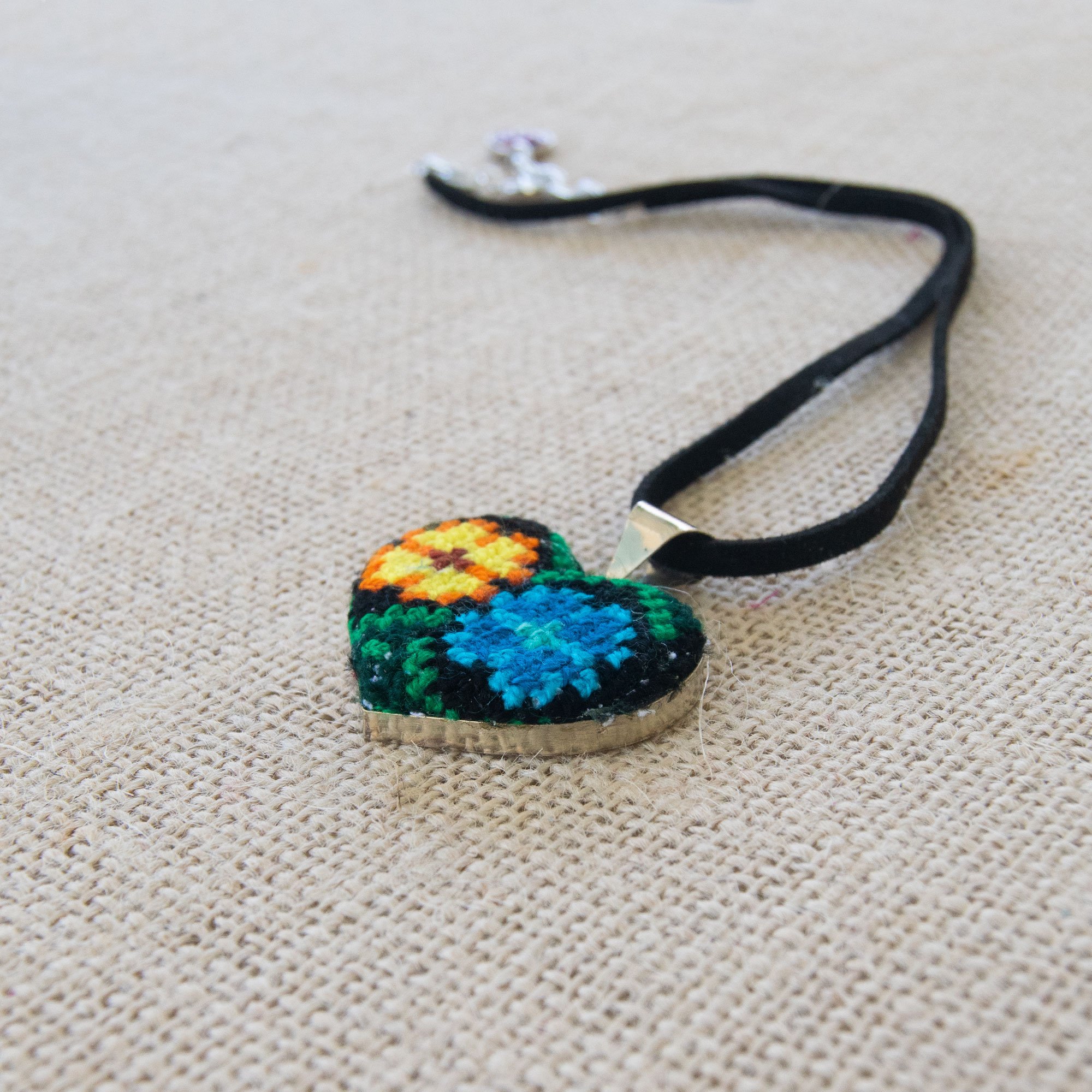 Ocosingo Heart Embroidered Necklace featuring vibrant colors and intricate designs, handcrafted by artisans from Chiapas, Mexico.