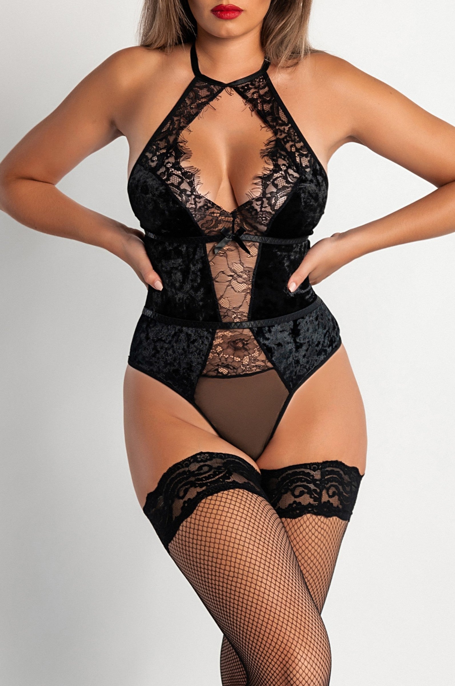 Ocosingo black one-piece underwear featuring lace detailing and a deep neckline, showcasing its elegant design.