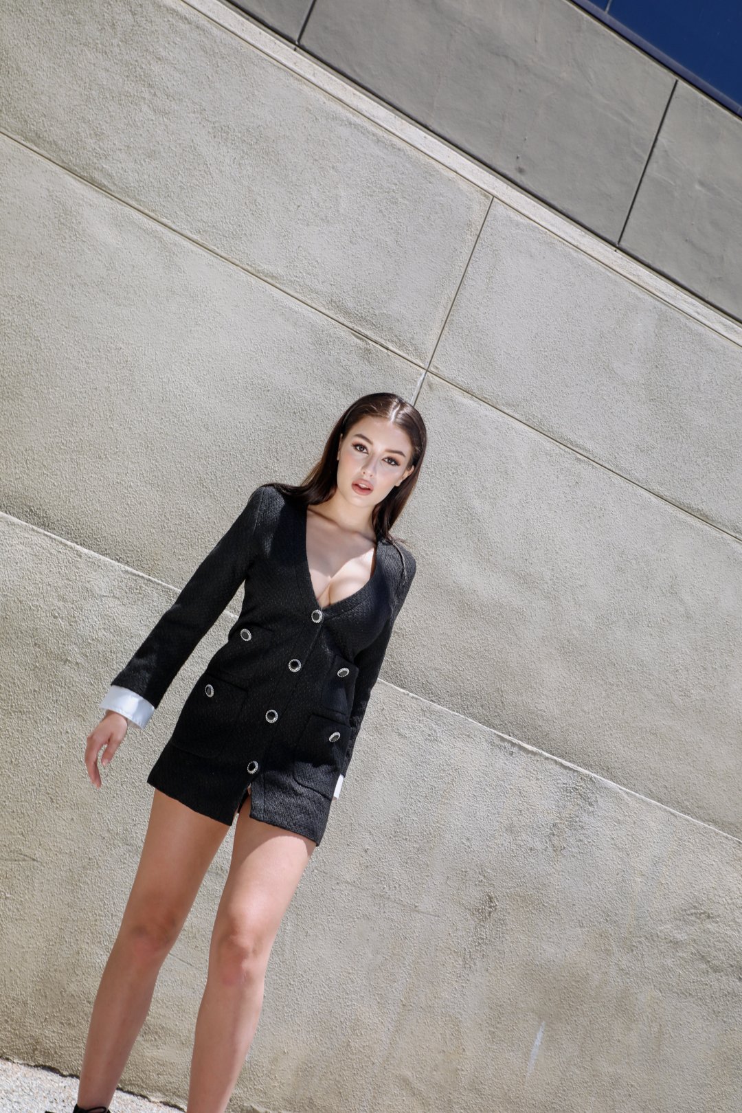 Odette Textured Blazer Dress in midnight black with gemstone accents and structured shoulders, featuring a deep V neckline and functional patch pockets.