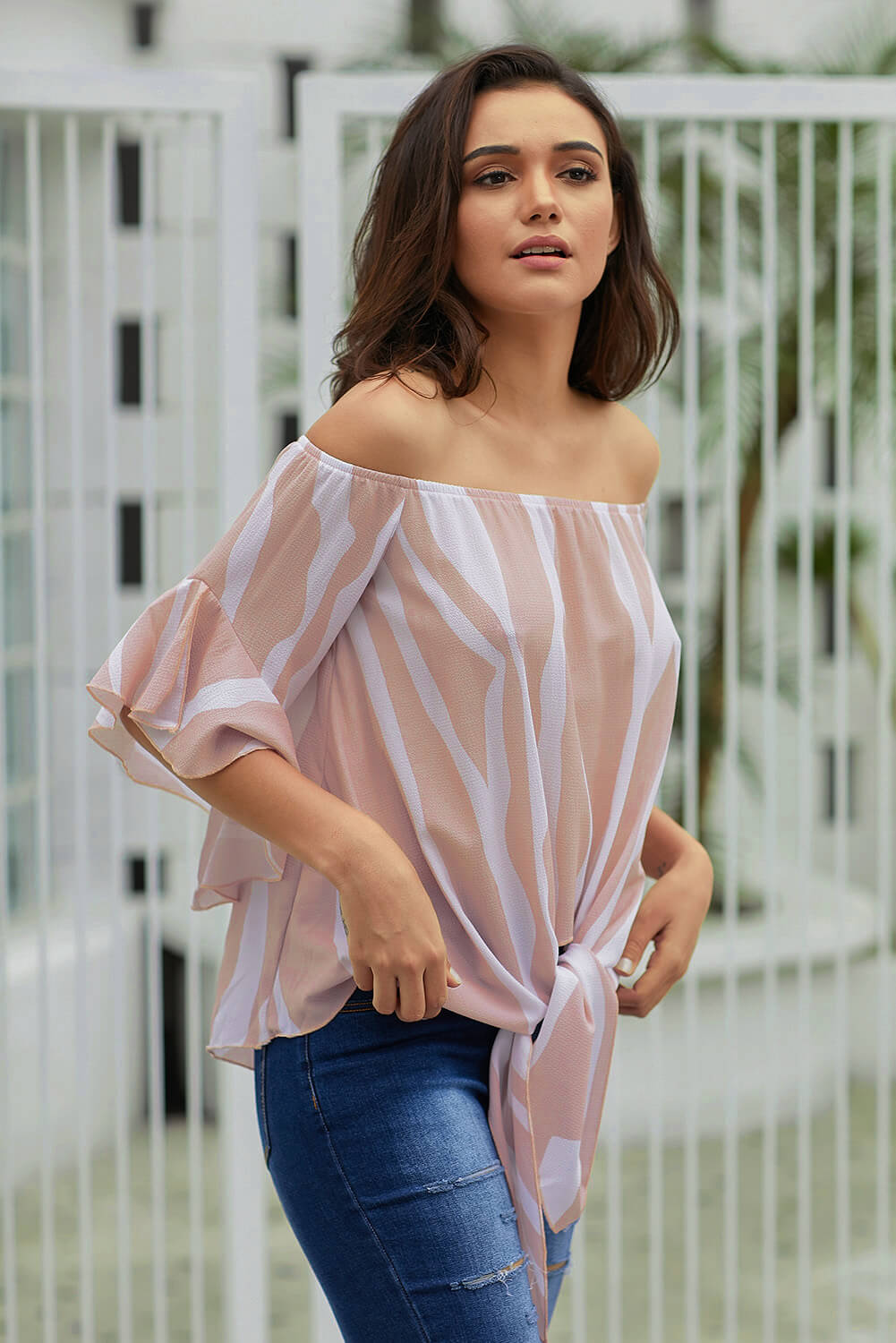 Off The Shoulder Pink White Vertical Stripes Blouse with ruffles and tie front design, perfect for summer wear.