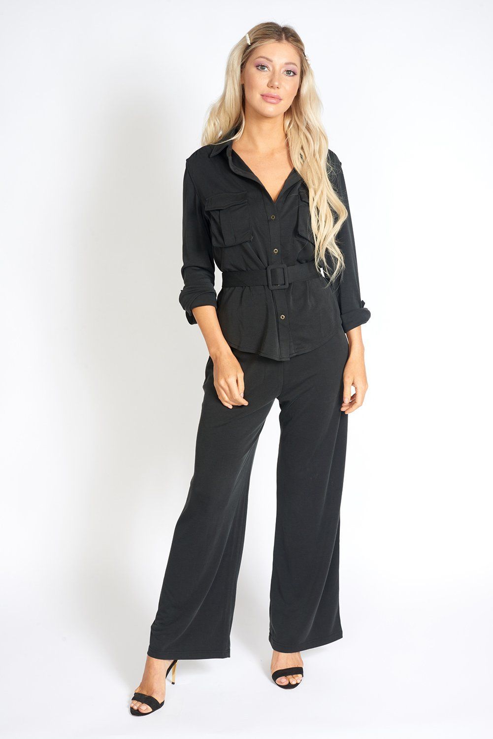 A pair of stylish black wide leg pants with an elasticized waist, showcasing a soft fabric and loose fit, ideal for office wear.