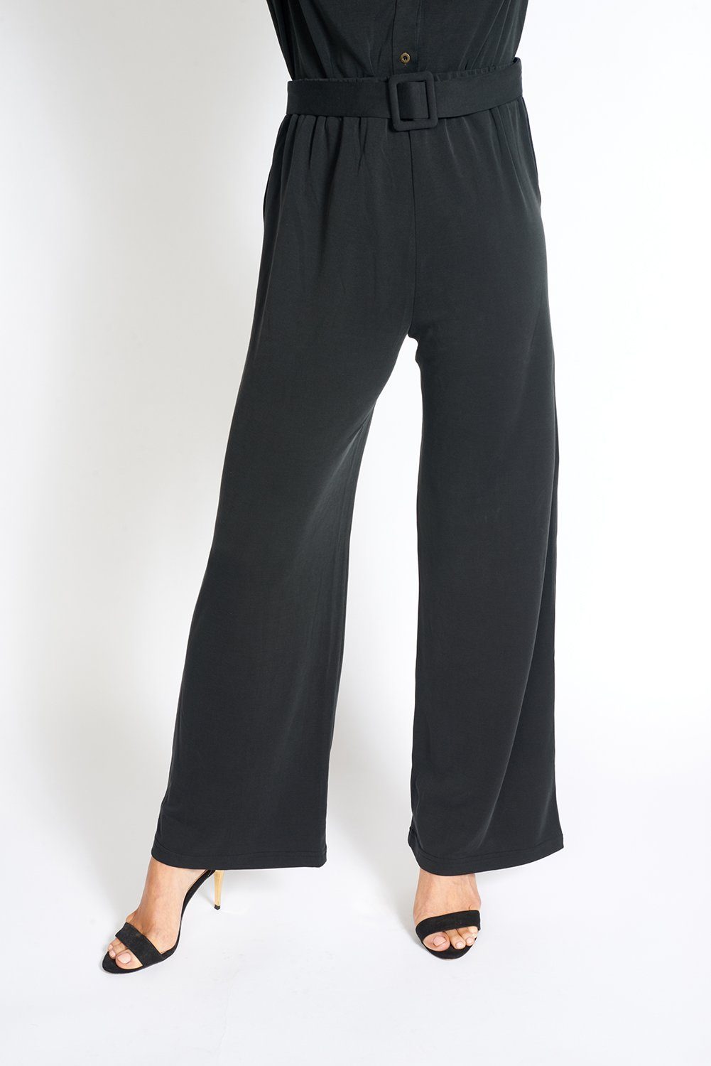 A pair of stylish black wide leg pants with an elasticized waist, showcasing a soft fabric and loose fit, ideal for office wear.