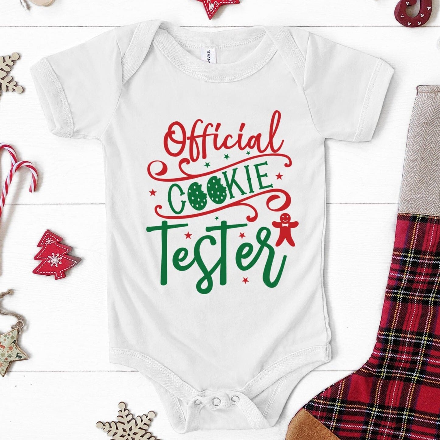 A cute baby wearing the Official Cookie Tester Onesie, showcasing its fun design and vibrant color.