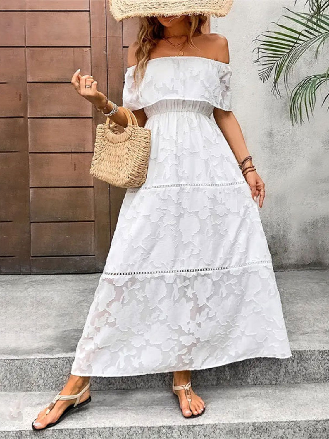 A stylish off-shoulder short sleeve maxi dress in a light fabric, perfect for summer occasions.