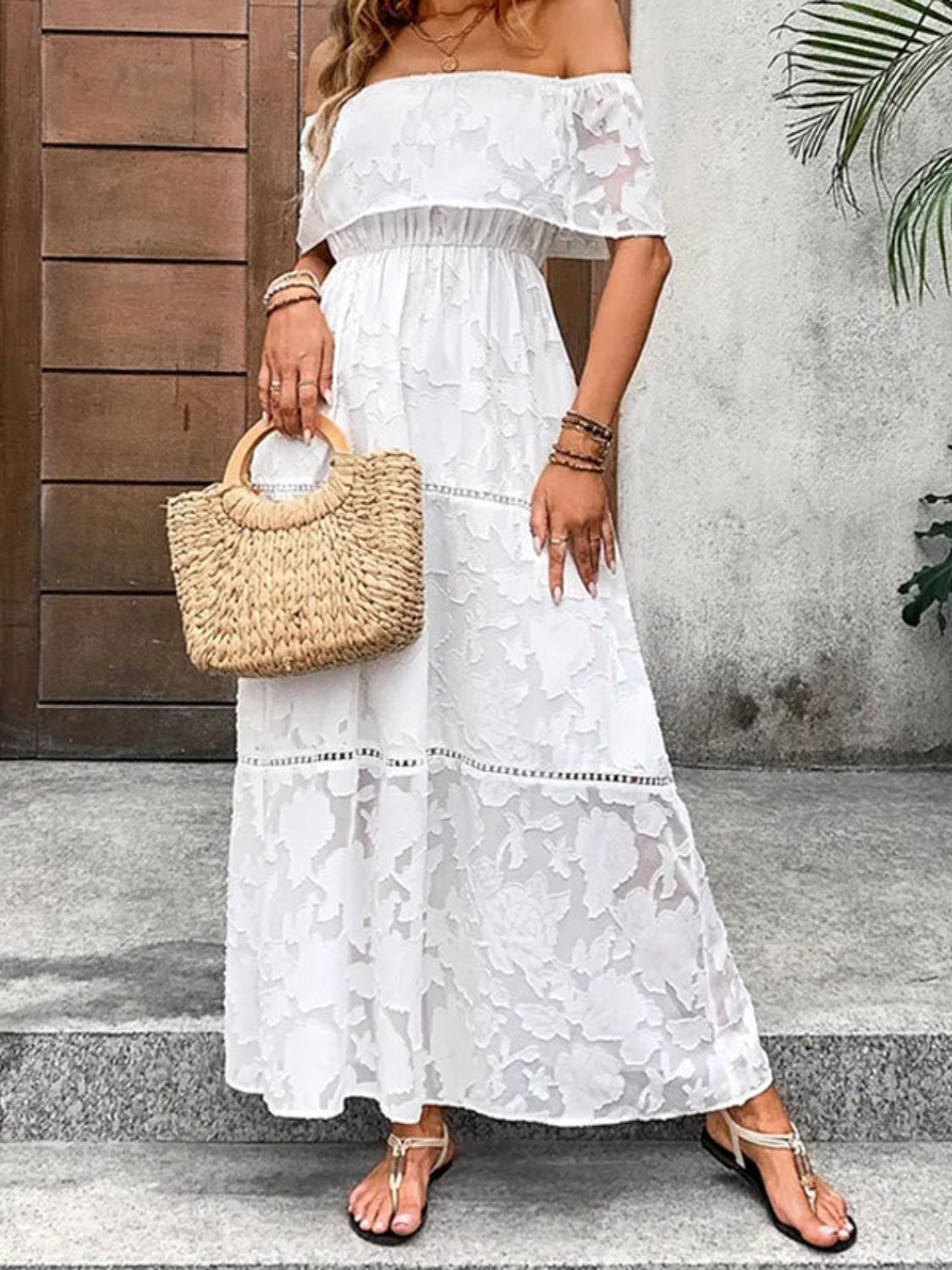 A stylish off-shoulder short sleeve maxi dress in a light fabric, perfect for summer occasions.