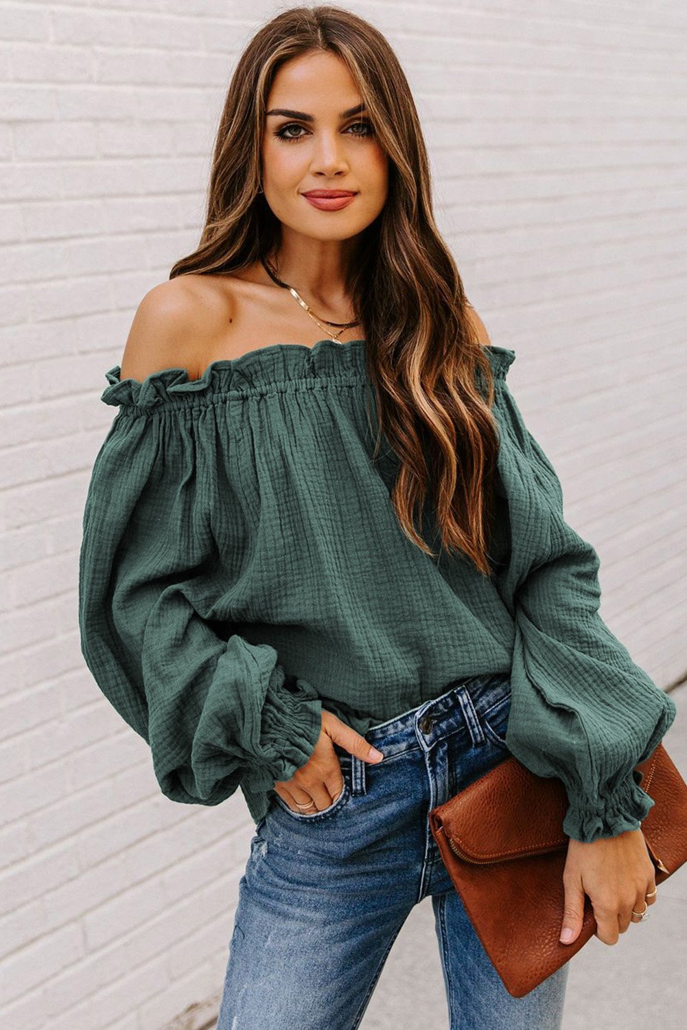 A stylish Off-the-shoulder Ruffle Top featuring an elastic ruffled neckline and flowy sleeves, perfect for casual or dressy occasions.