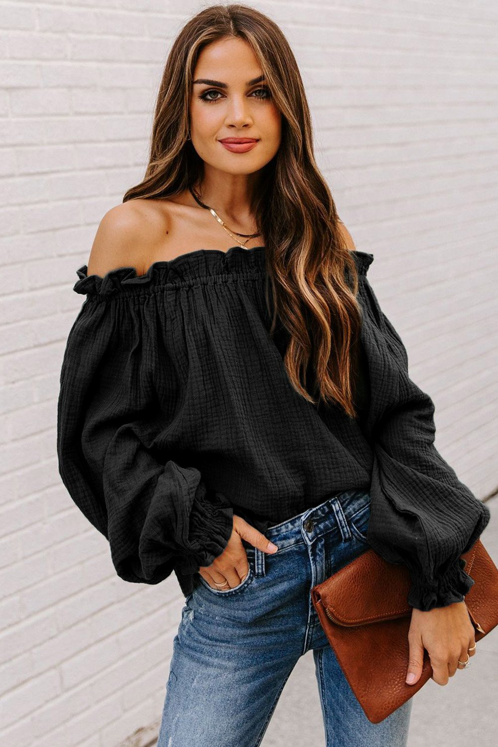 A stylish Off-the-shoulder Ruffle Top featuring an elastic ruffled neckline and flowy sleeves, perfect for casual or dressy occasions.