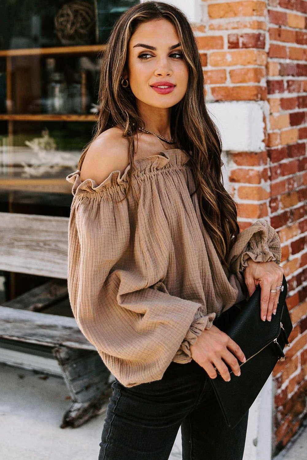 A stylish Off-the-shoulder Ruffle Top featuring an elastic ruffled neckline and flowy sleeves, perfect for casual or dressy occasions.