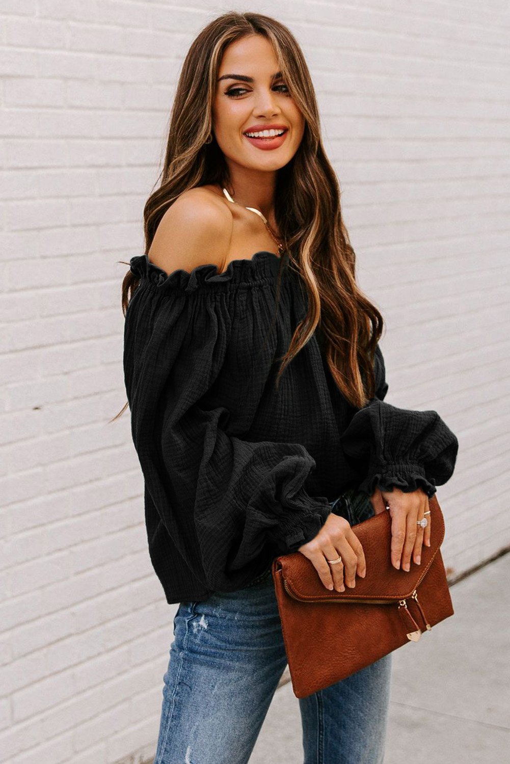 A stylish Off-the-shoulder Ruffle Top featuring an elastic ruffled neckline and flowy sleeves, perfect for casual or dressy occasions.