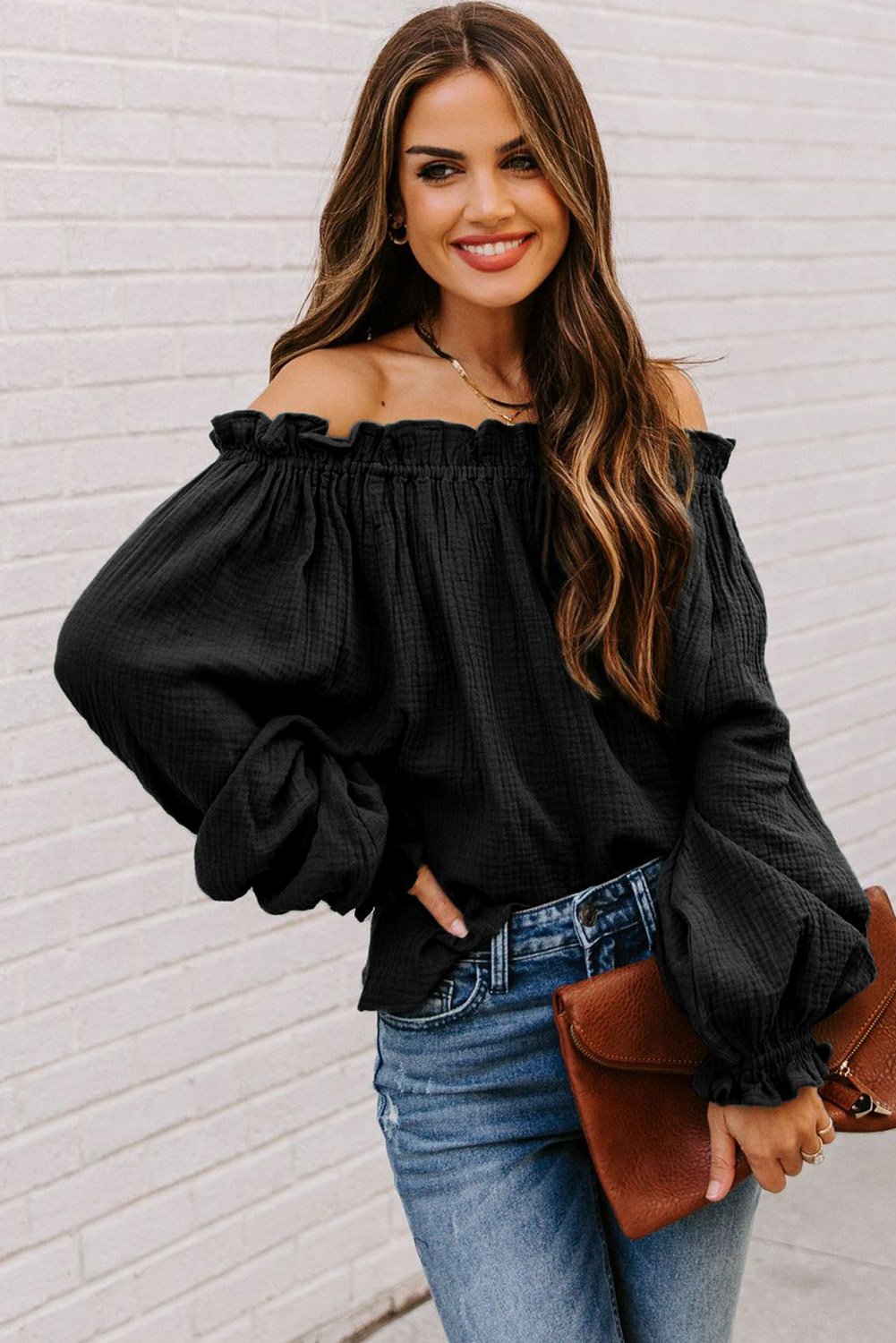 A stylish Off-the-shoulder Ruffle Top featuring an elastic ruffled neckline and flowy sleeves, perfect for casual or dressy occasions.