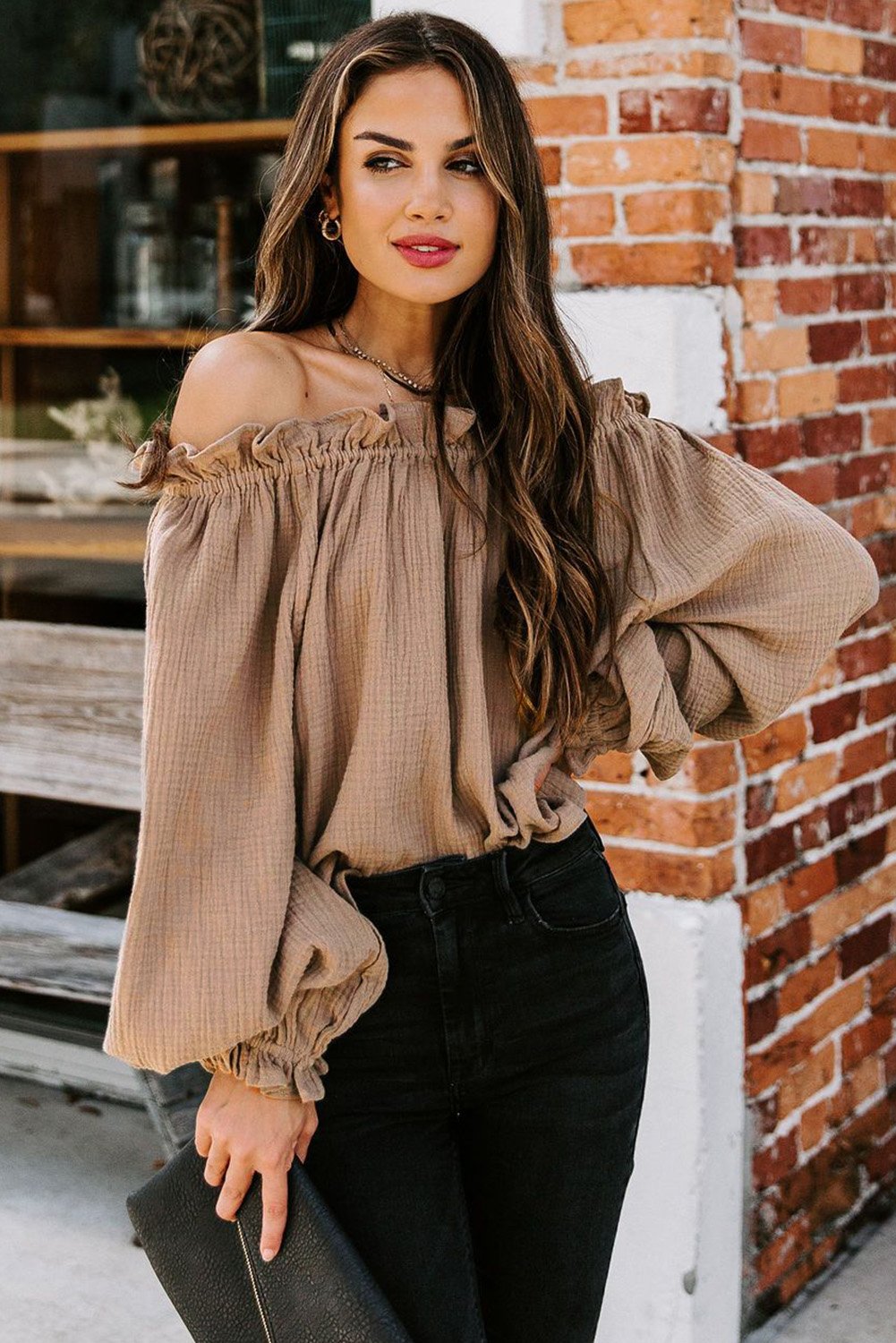 A stylish Off-the-shoulder Ruffle Top featuring an elastic ruffled neckline and flowy sleeves, perfect for casual or dressy occasions.