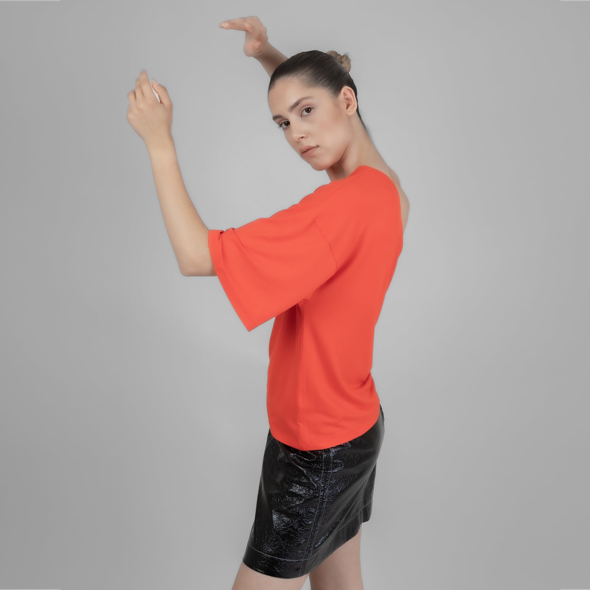 A stylish one shoulder red top made from cotton and elastane, showcasing a trendy design perfect for various occasions.