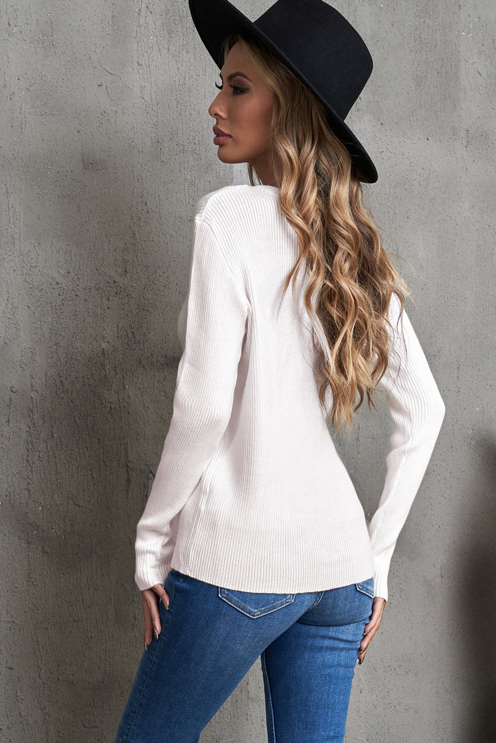 One-Shoulder Long Sleeve Ribbed Top displayed outdoors, showcasing its chic design and ribbed texture.