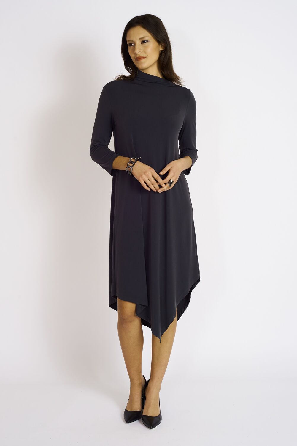 The Onyx Dress featuring a unique neckline and angled hem, showcasing its modern design and comfortable fit.