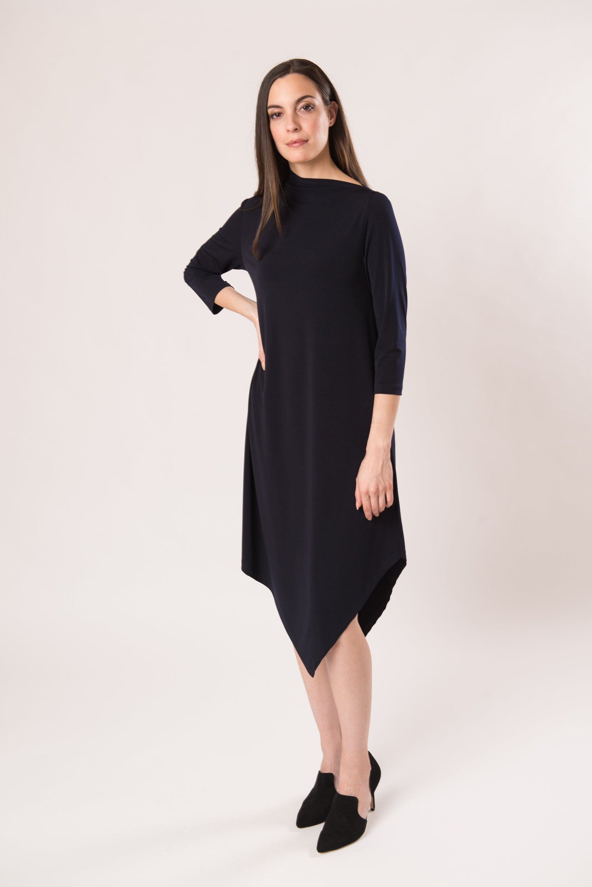 The Onyx Dress featuring a unique neckline and angled hem, showcasing its modern design and comfortable fit.