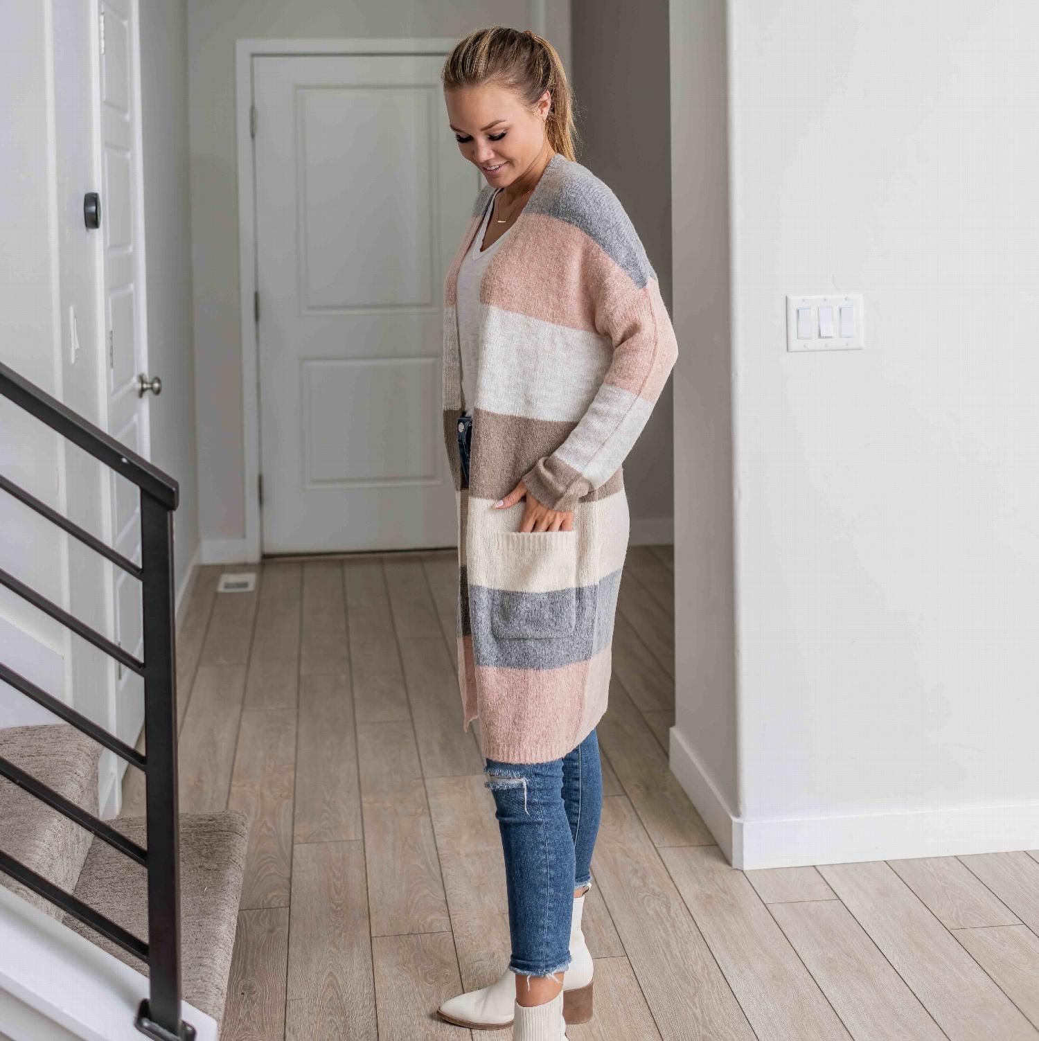 Open Front Color Block Cardigan featuring a long design with wide stripes in warm and cool colors, complete with large hip pockets.