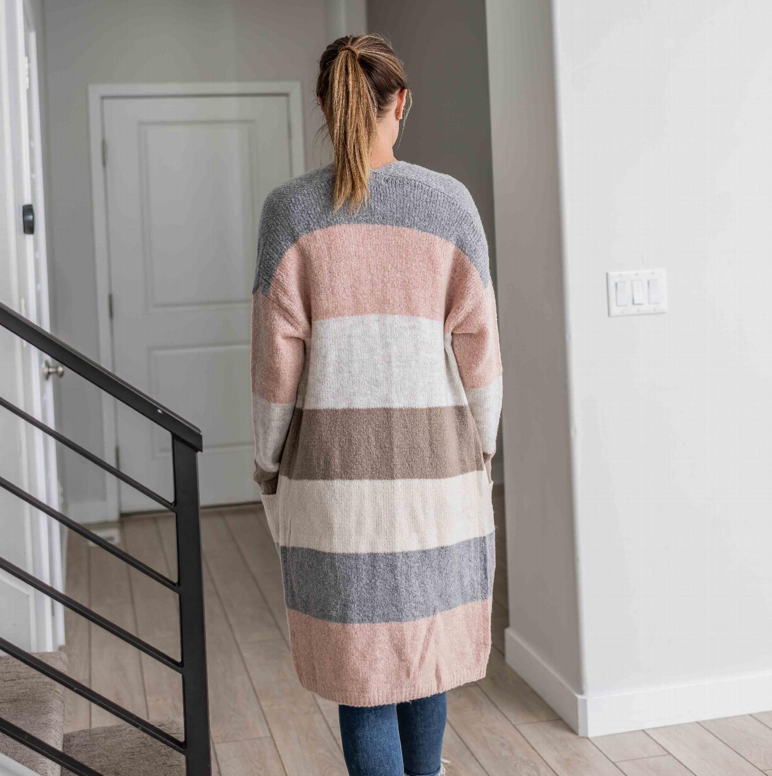 Open Front Color Block Cardigan featuring a long design with wide stripes in warm and cool colors, complete with large hip pockets.