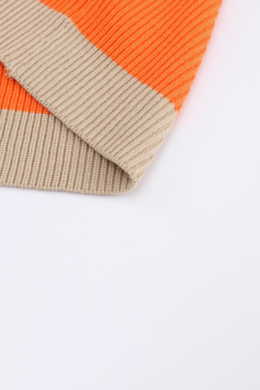 Orange Colorblock Ribbed Knit Cardigan displayed on a mannequin, showcasing its trendy design and soft ribbed fabric.