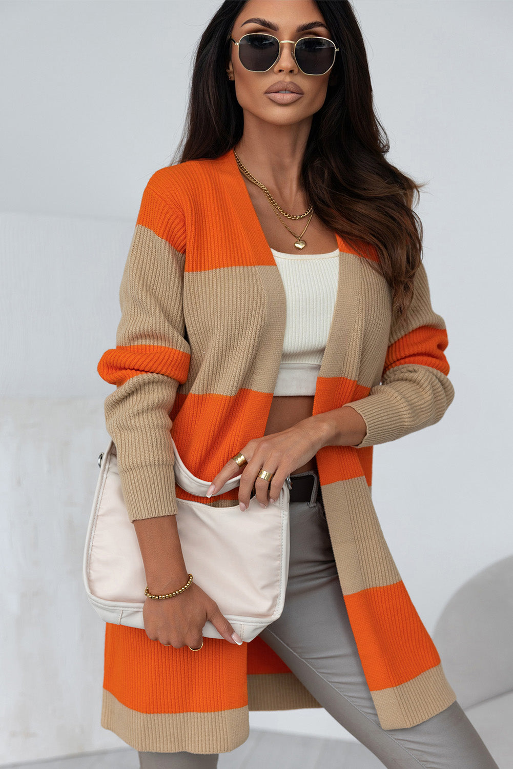 Orange Colorblock Ribbed Knit Cardigan displayed on a mannequin, showcasing its trendy design and soft ribbed fabric.