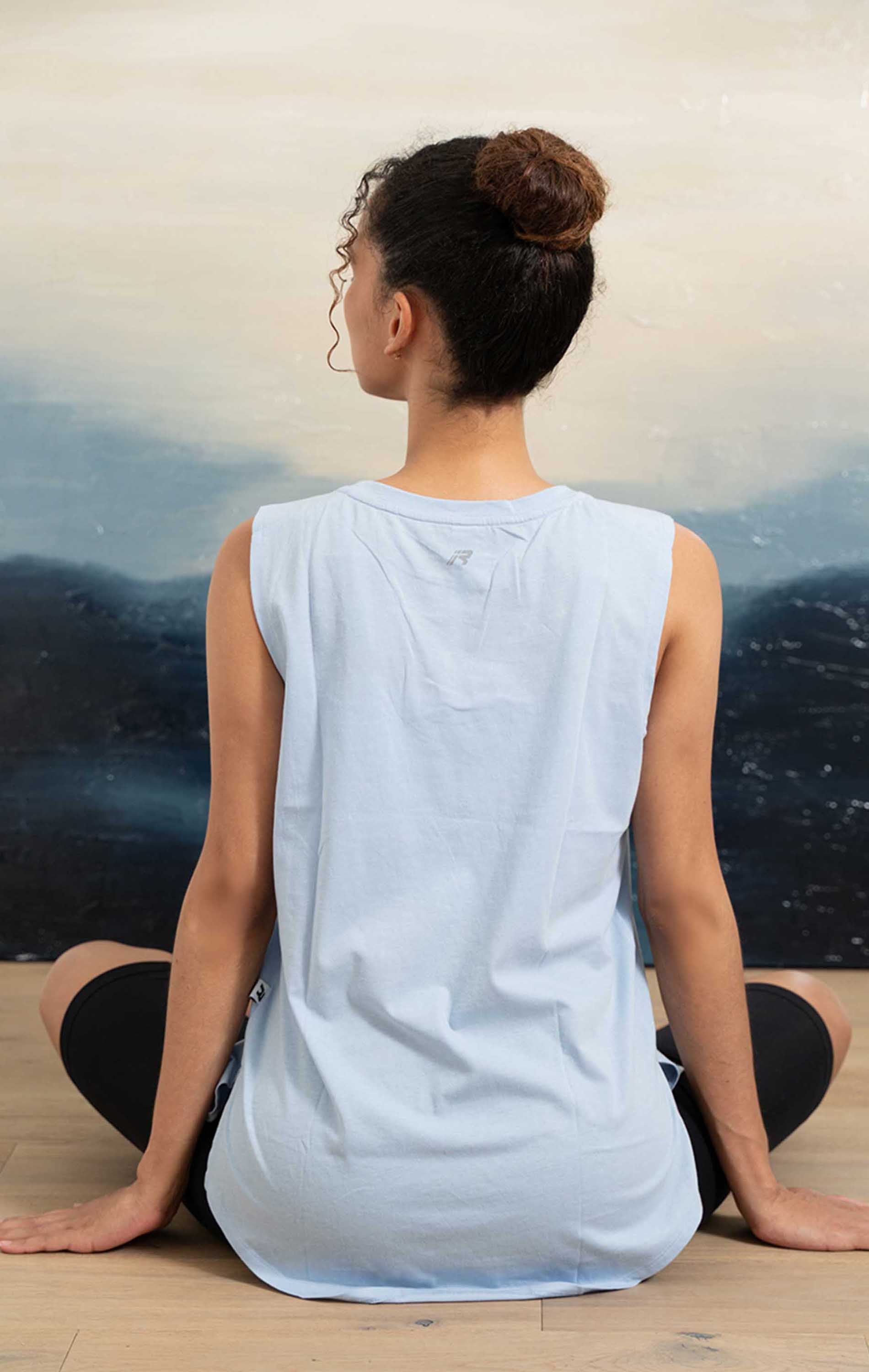 Orchid Muscle Tank Top in Baby Blue, featuring a boxy fit and oversized armholes for breathability, perfect for workouts and casual wear.