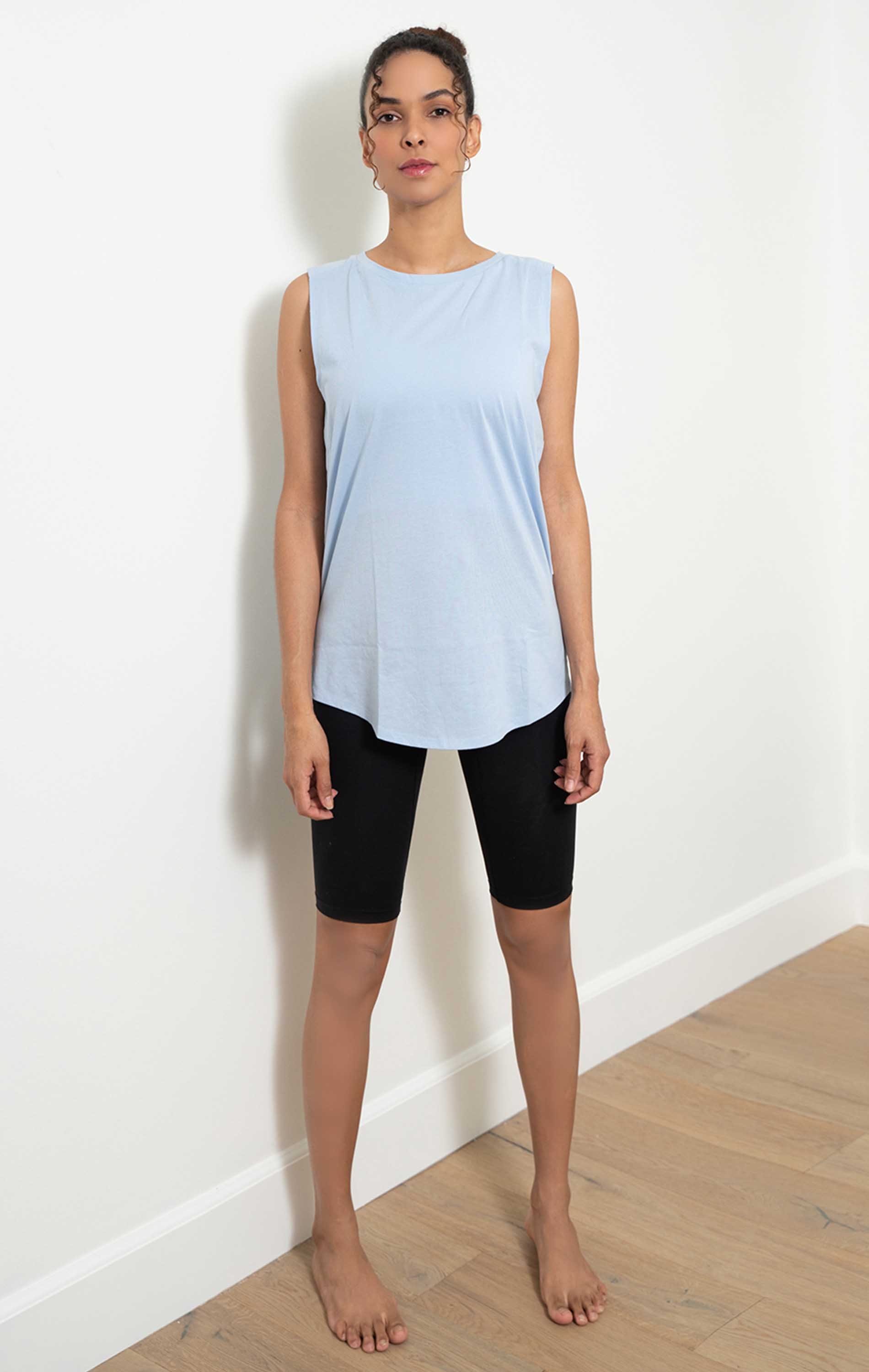 Orchid Muscle Tank Top in Baby Blue, featuring a boxy fit and oversized armholes for breathability, perfect for workouts and casual wear.