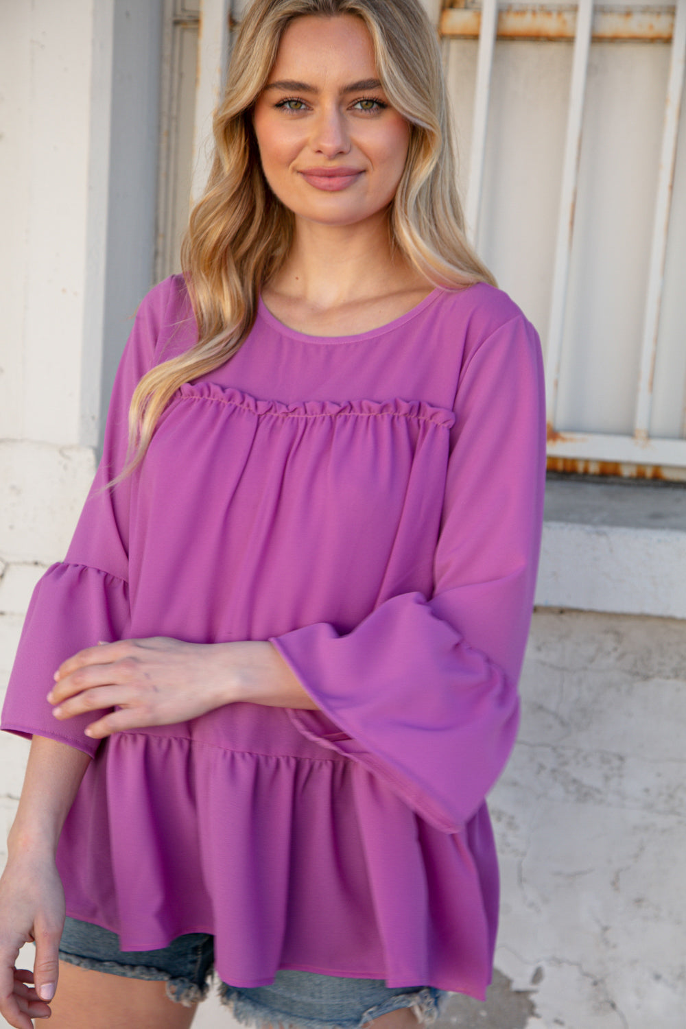 Orchid Round Neck Frill Detail Crepe Blouse featuring a frill yoke and bell sleeves, perfect for stylish outings.