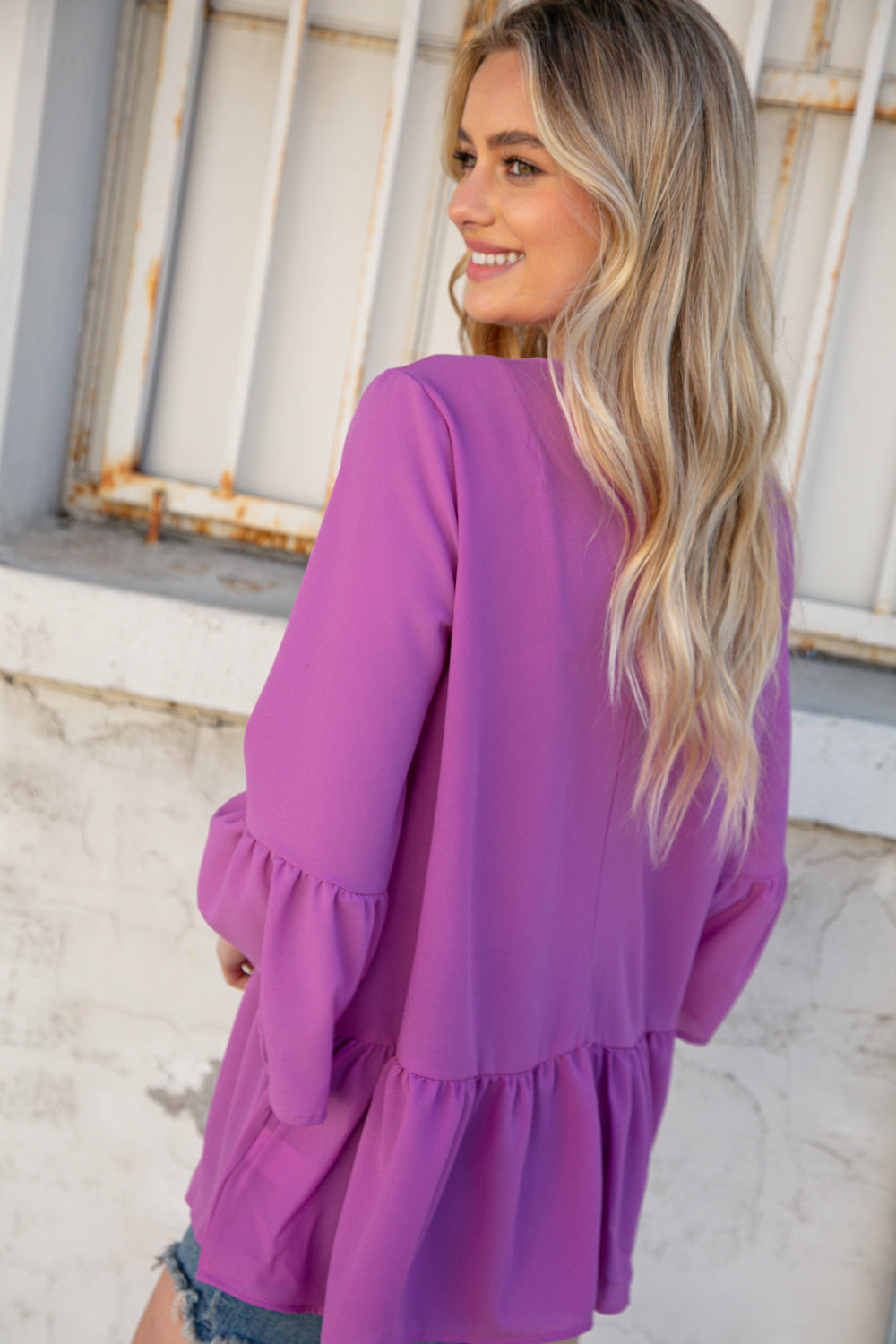 Orchid Round Neck Frill Detail Crepe Blouse featuring a frill yoke and bell sleeves, perfect for stylish outings.