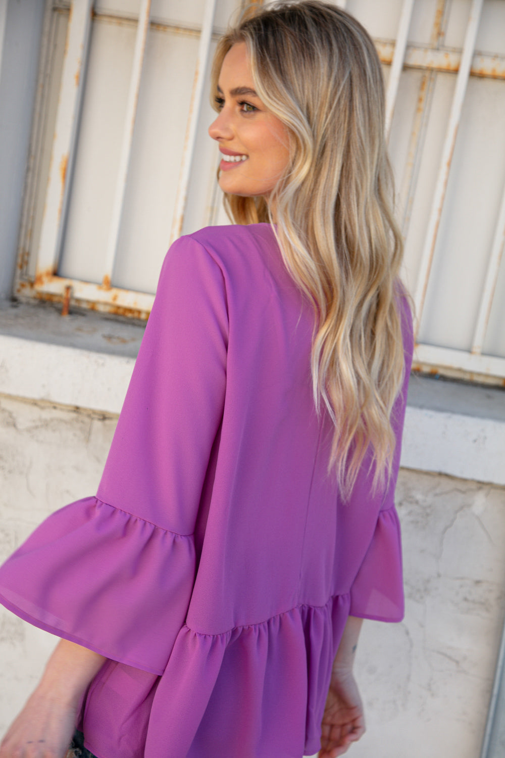 Orchid Round Neck Frill Detail Crepe Blouse featuring a frill yoke and bell sleeves, perfect for stylish outings.