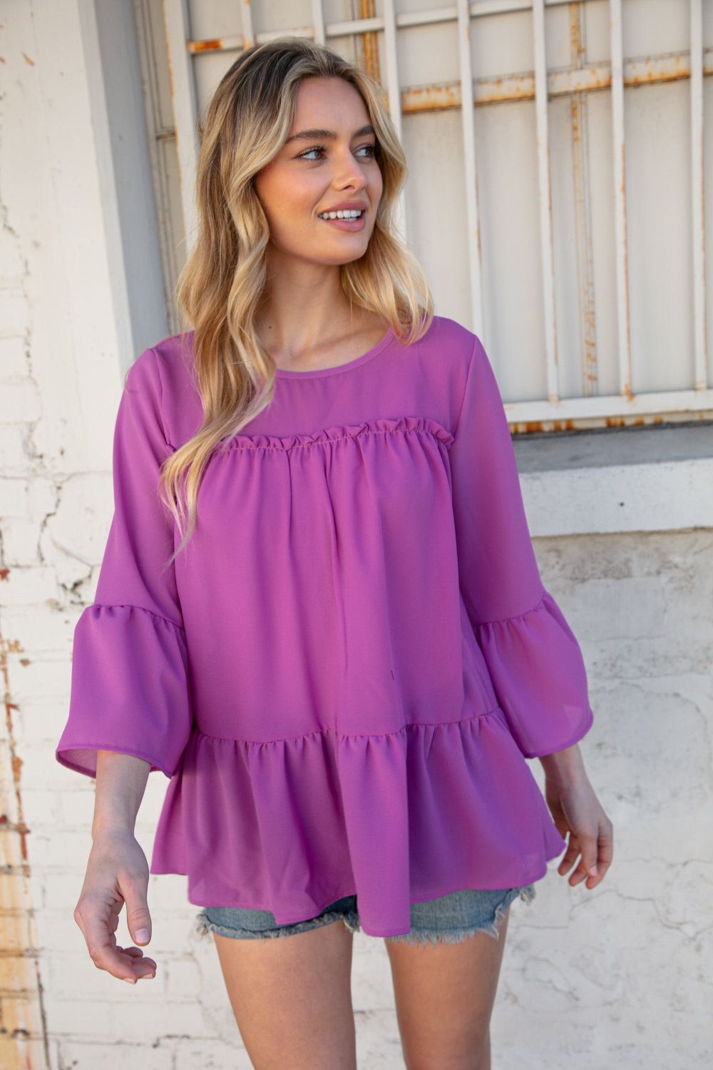 Orchid Round Neck Frill Detail Crepe Blouse featuring a frill yoke and bell sleeves, perfect for stylish outings.