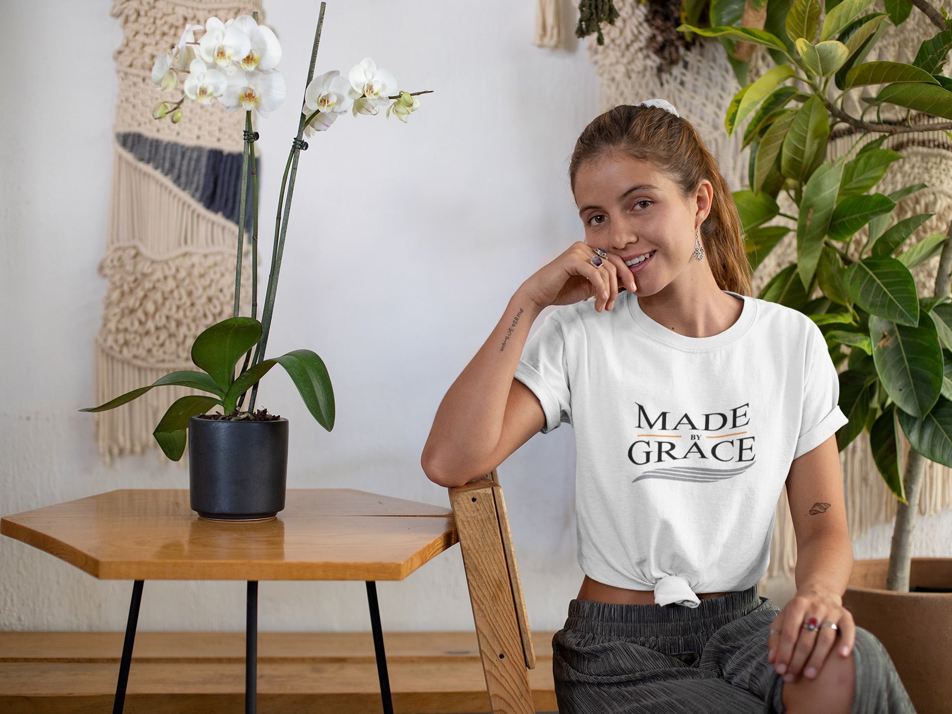 Organic Made By Grace T-shirt made from 100% organic cotton, featuring a ribbed neck collar and hemmed sleeves, available in various sizes.